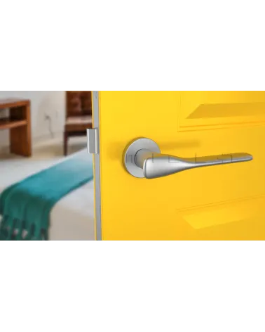 Satin chrome ORCHIDE door handle designer handle front view mounted on a door