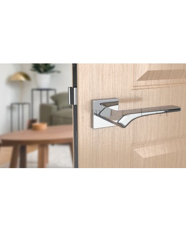 BERGERIA polished chrome door handle designer ironmongery front view mounted on a door