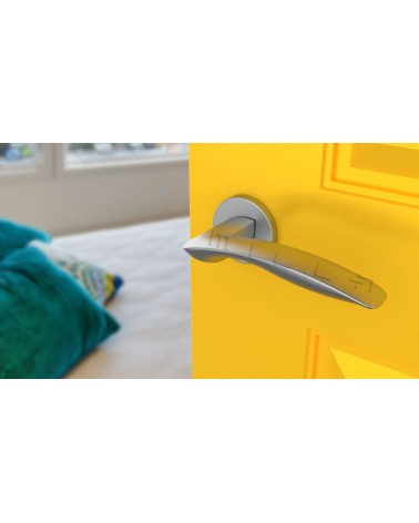 Satin chrome ROBINE door handle design hardware angled top view mounted on a door