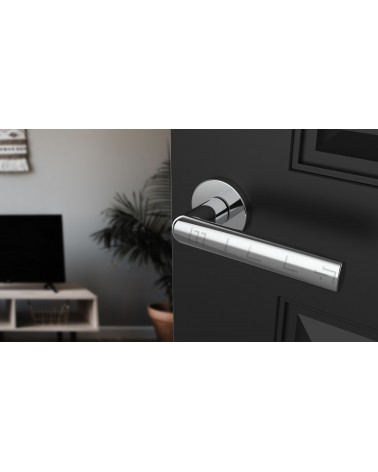 SILENA polished chrome door handle designer hardware angled view mounted on a door