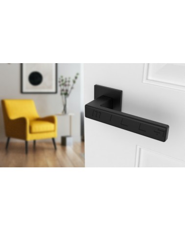 Black pearl TILLIA door handle interior door design angled view mounted on a door