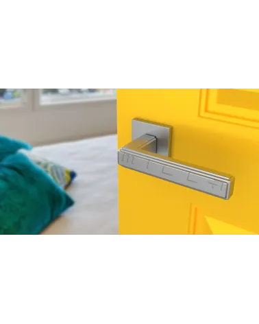 RAFLESIA square plate door handle design handle fitted on an open yellow door