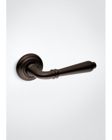 Matt bronze Mandelli Sevilla door handle design handle on a background