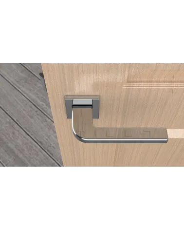 Polished chrome ISMENA door handle designer handle top view mounted on a door