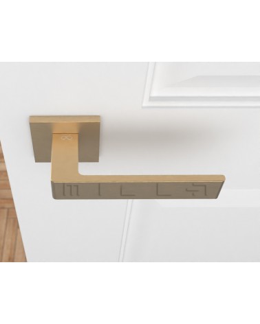 Matt gold Apollo door handle design handle top view mounted on a door