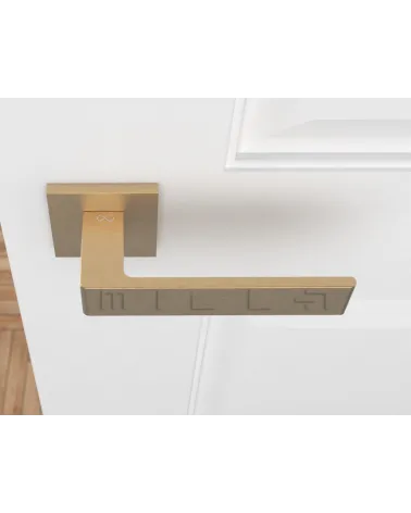 Matt gold Apollo door handle design handle top view mounted on a door