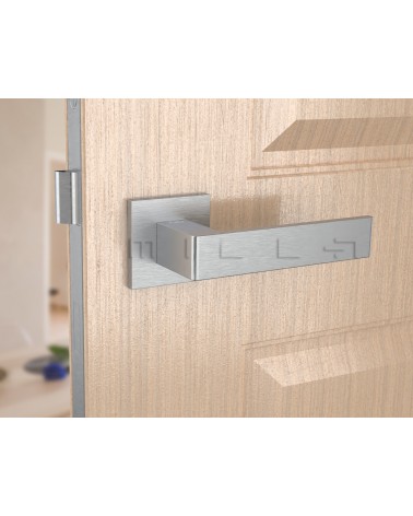 Brushed chrome Apollo design door handle front view mounted on a door