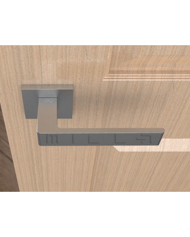 Brushed chrome Apollo design door handle top view mounted on a door