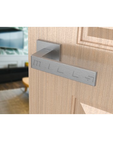 Brushed chrome Apollo design door handle angled view mounted on a door