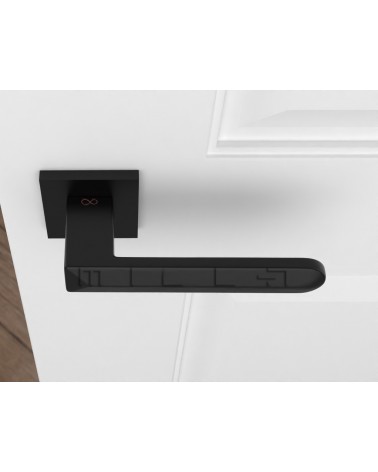 Black Bohema door handles on a white door top view