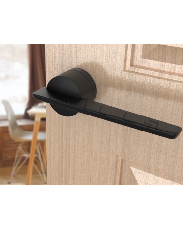 Black JUMELLE design door handle angled view mounted on a door