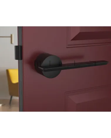 Futuristic JUMELLE design door handle front view mounted on a door