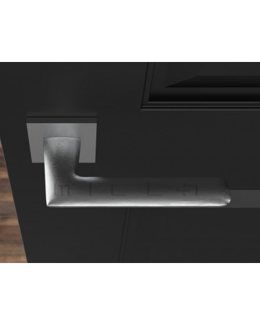 Polished chrome door handle Line GIULIA design handle top view mounted on a door