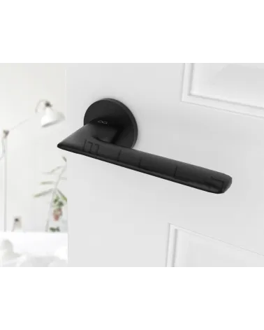 Black door handle Line GIULIA design handle top angled view mounted on a door