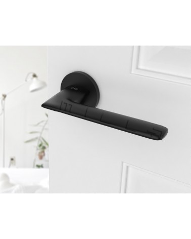 Black door handle Line GIULIA design handle top angled view mounted on a door