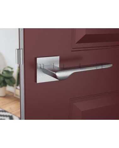Brushed chrome LINE design door handle front view mounted on a door