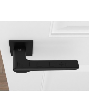 Black LIGNE design door handle top view mounted on a door
