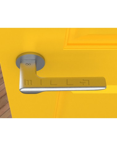 Brushed chrome LIGNE design door handle top view mounted on a door