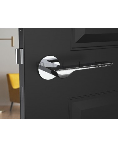 LIGNE polished chrome design door handle front view mounted on a door