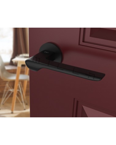 LIGNE black design door handle tilted view mounted on a door