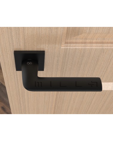 Black STINGER door handle designer handle top view mounted on a door