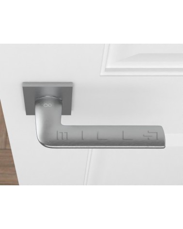 STINGER brushed chrome designer door handle top view mounted on a door