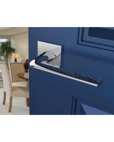 Polished chrome STINGER door handle designer handle angled view mounted on a door