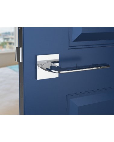Polished chrome STINGER door handle designer handle front view mounted on a door