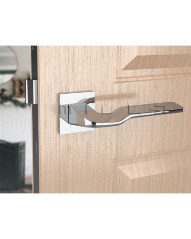 Polished chrome LINE BALI door handle design ironmongery front view mounted on a door