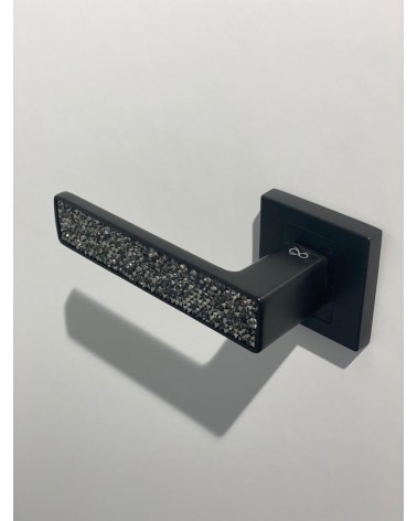 Black GLAMOUR door handle design ironmongery tilted top view mounted on a door