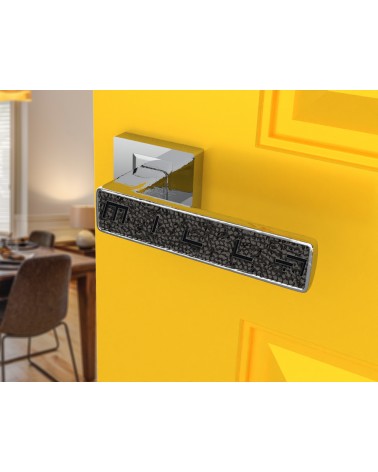 Polished chrome GLAMOUR door handle design ironmongery angled view mounted on a door 1