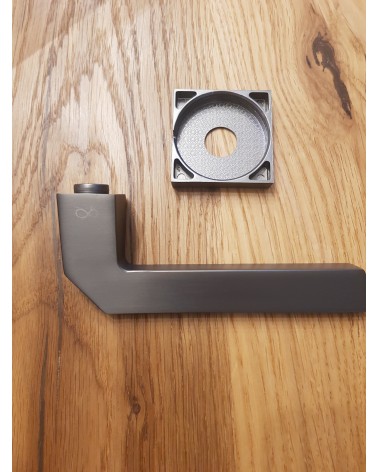 ETNA door handle designer hardware colour 4 placed on a plate