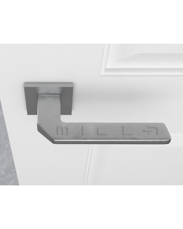 Satin chrome ETNA door handle design hardware top view mounted on a door