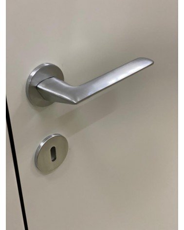 Brushed chrome Line GIULIA door handle design handle bottom view mounted on a door