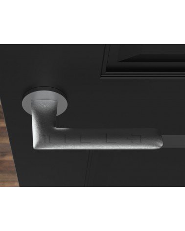 Brushed chrome Line GIULIA door handle design handle top view mounted on a door