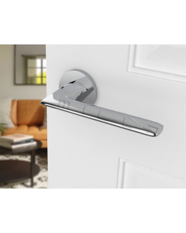 Polished chrome door handle Line GIULIA designer handle angled top view mounted on a door