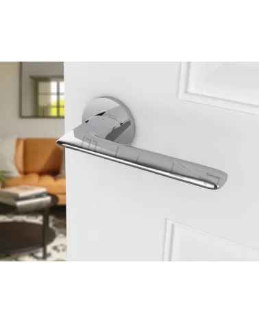 Polished chrome door handle Line GIULIA designer handle angled top view mounted on a door