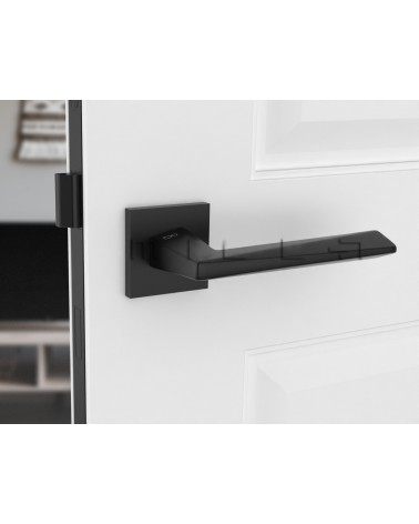 Black DIAMANT door handle design front view mounted on a door