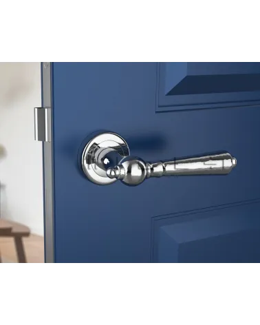 Polished chrome MILLENAIRE door handle designer handle front view mounted on a door