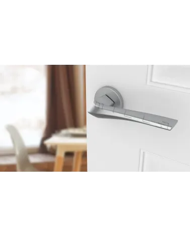 DALIA round plate door handle designer handle colour 4 angled top view mounted on a door