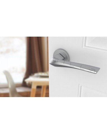DALIA round plate door handle designer handle colour 4 angled top view mounted on a door