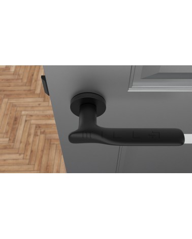 ORCHIDE round plate door handle design handle colour 1 top view mounted on a door