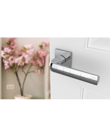 MELA square plate door handle designer ironmongery colour 1 angled top view mounted on a door