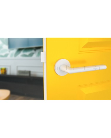 KALMIA round plate door handle design handle colour 4 front view mounted on a door