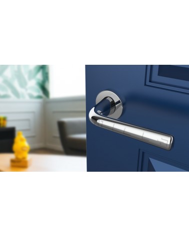 TULIPA round plate door handle designer handle angled top view mounted on a door