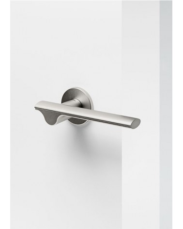 Mandelli Ara brass door handle designer handle mounted on a door