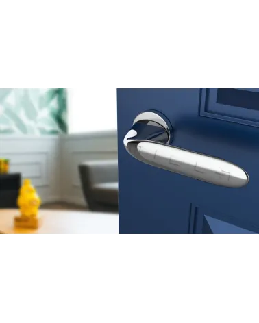 PEONIA zamak door handle design handle colour 1 top angled view mounted on a door