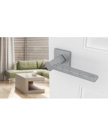 NINFEA zamak door handle designer handle colour 2 angled top view mounted on a door