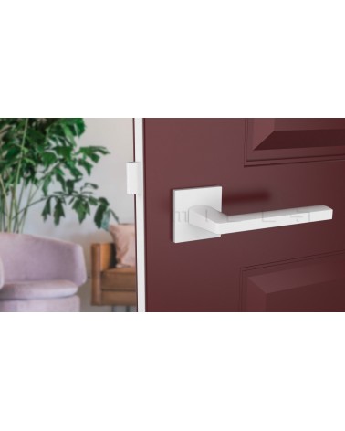 PYROLA zamak door handle design ironmongery front view mounted on a door