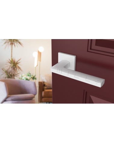 PYROLA zamak door handle design ironmongery angled top view mounted on a door